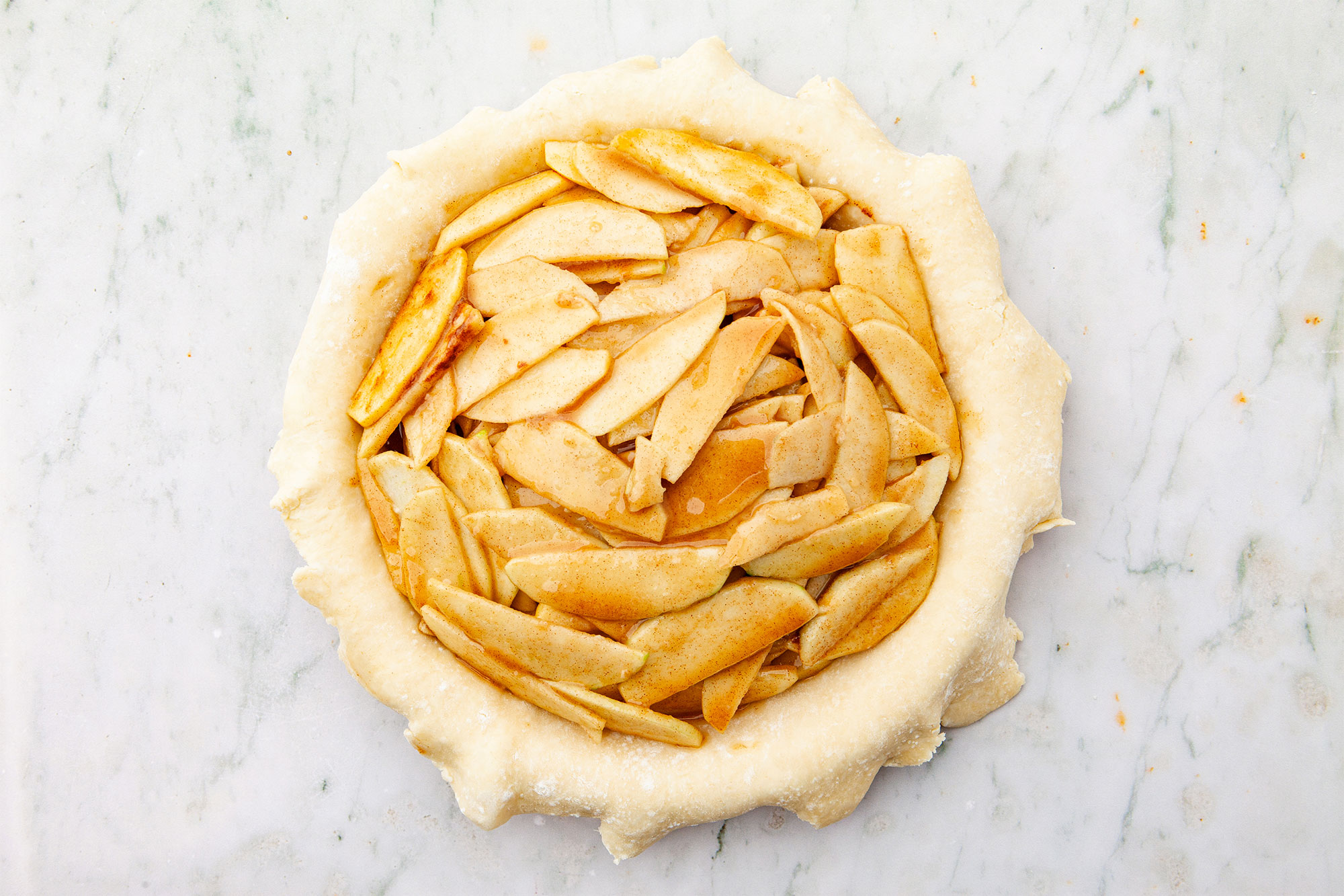 A bottom crust filled with apples.