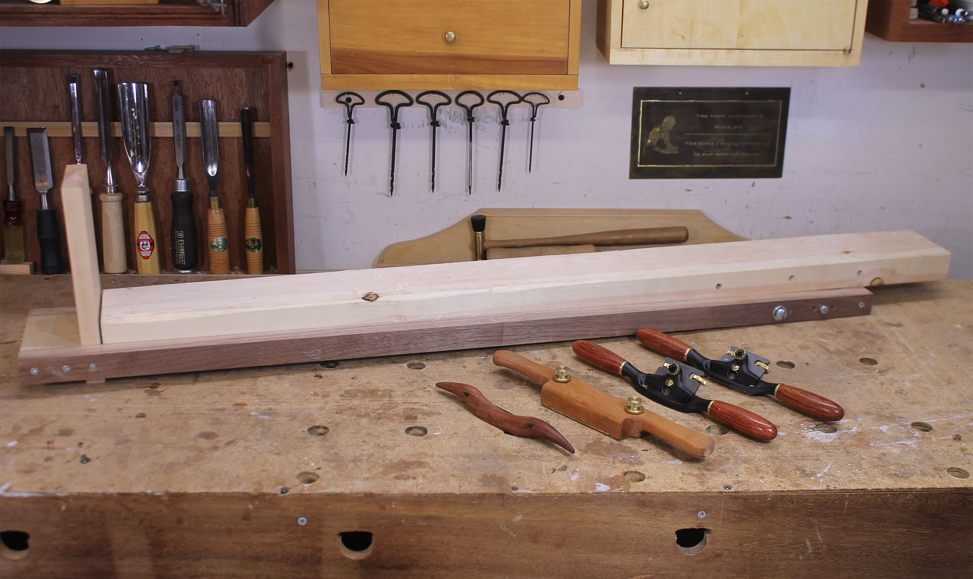 The fixture and several spokeshaves on the author’s workbench.