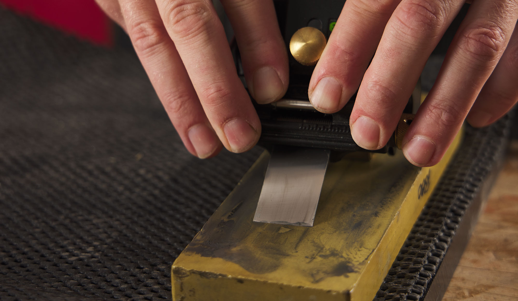 Honing a bench chisel on a sharpening stone