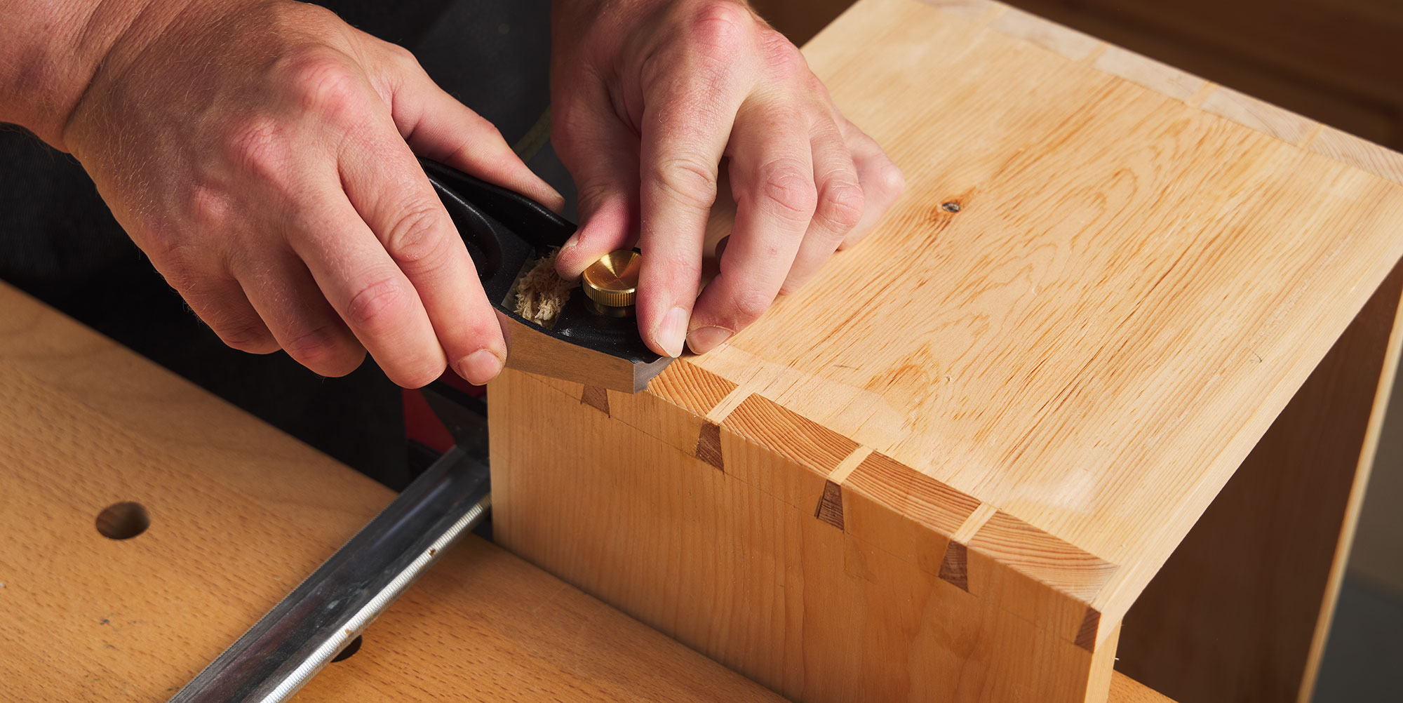 Planing a dovetail joint by skewing the blade and dampening the end grain.