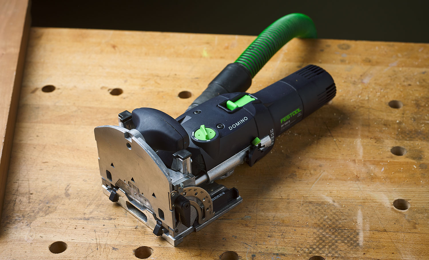 The Festool Domino DF500 sitting on a workbench top.
