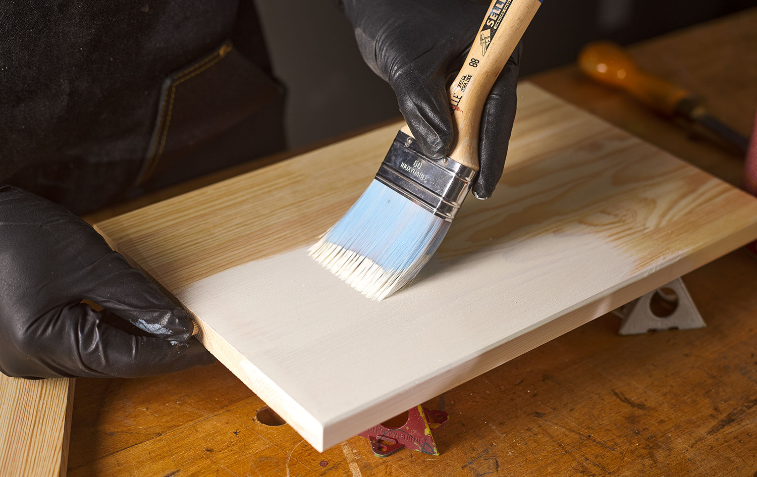 Applying General milk paint to raw wood