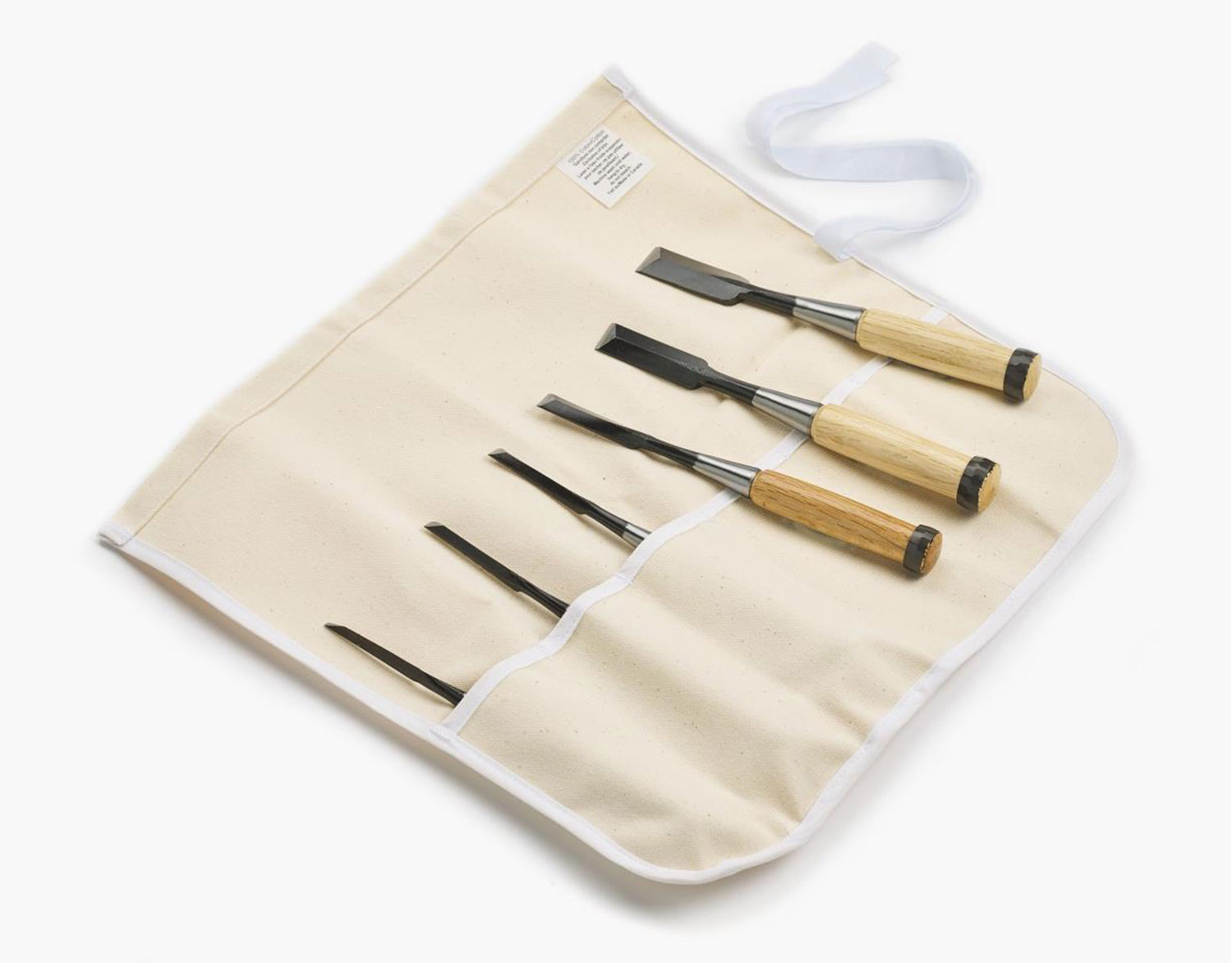 A set of Japanese chisels stored in a canvas tool roll.