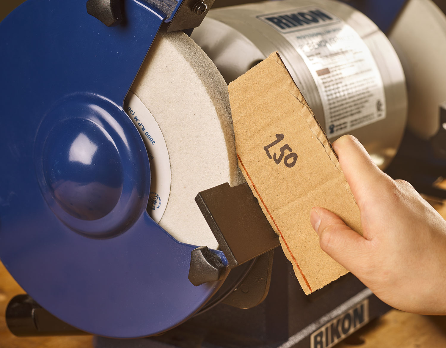 Photo 7 – You can use a simple shop-made cardboard jig to set the grinding angle.