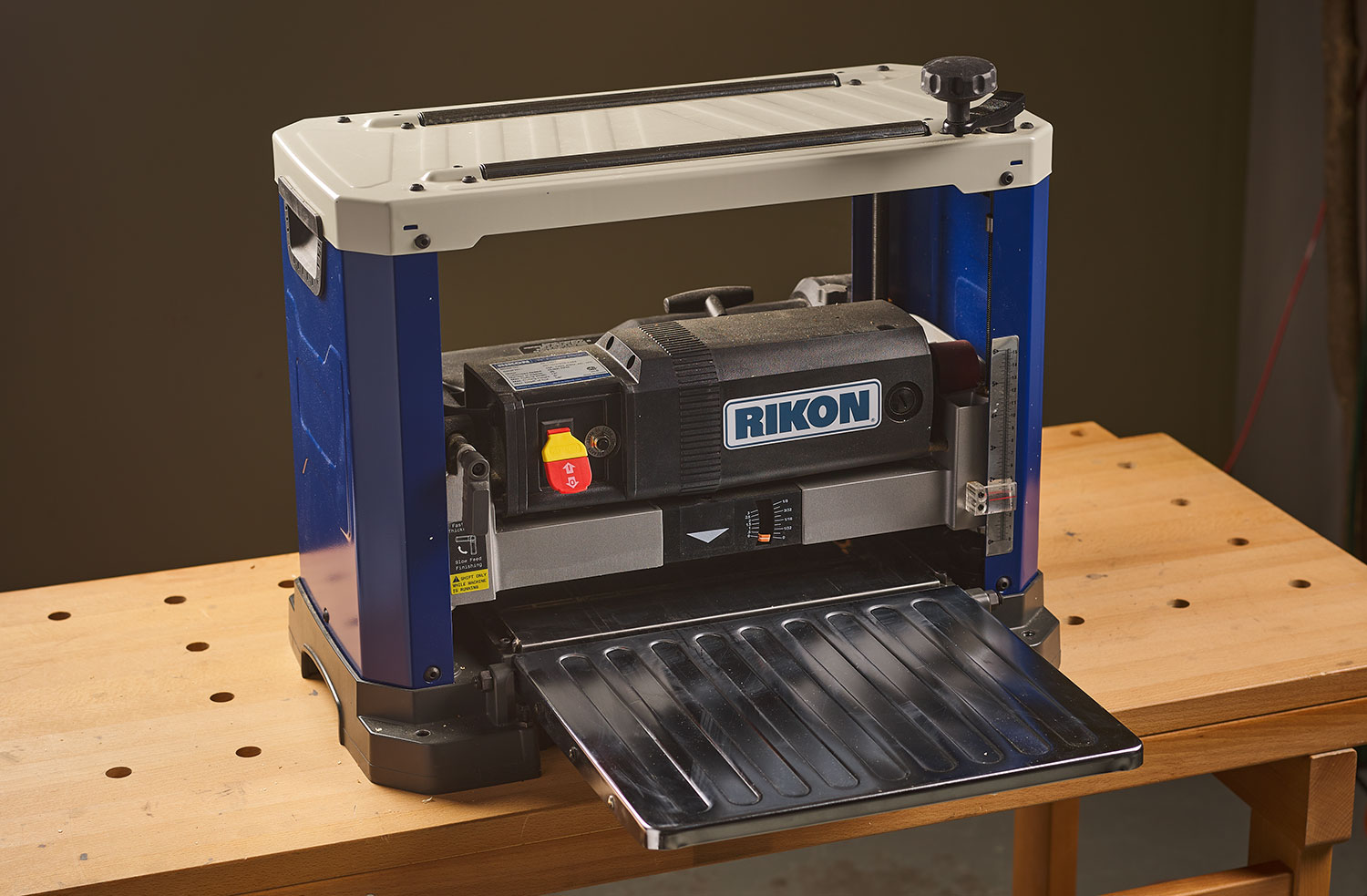 A Rikon helical planer on top of a workbench.