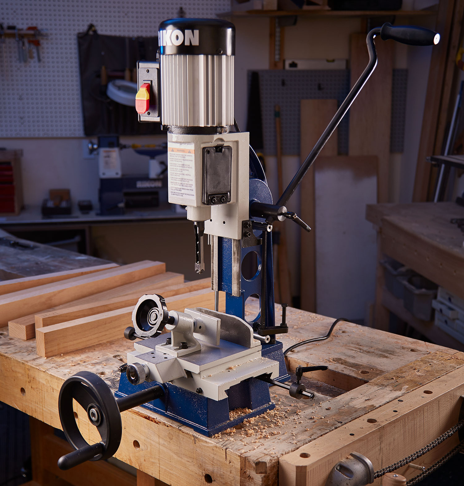 A Rikon chisel mortise is on a workbench.