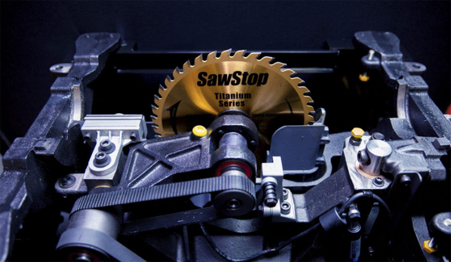 A view under the table of a Sawstop industrial cabinet saw.