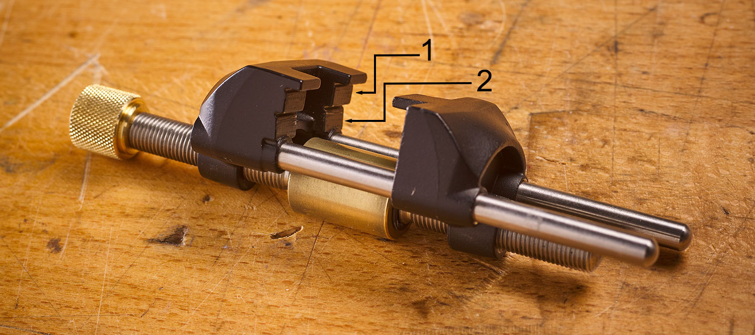 Honing guide has upper (1) and lower (2) clamping positions.