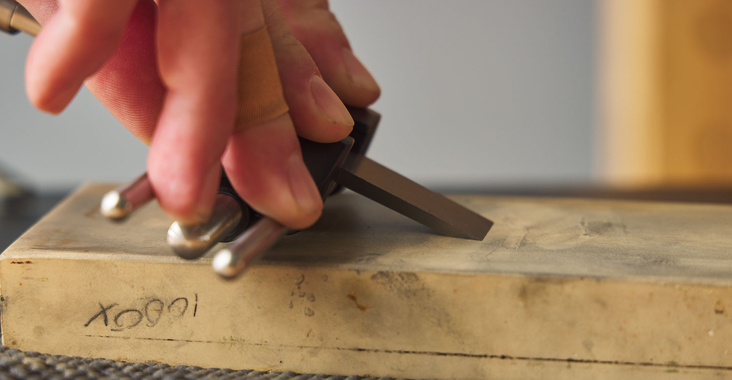 Ensuring the bevel is fully contacting the sharpening medium.