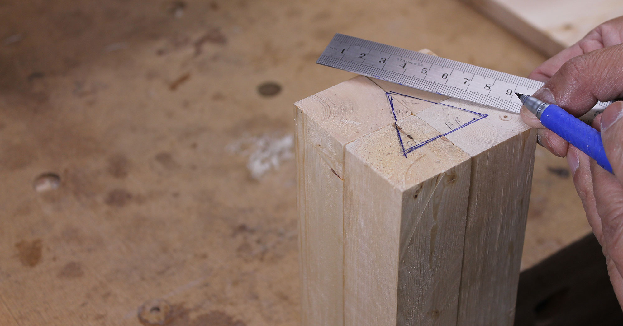 Using ruler and pen to make cabinetmaker’s marks