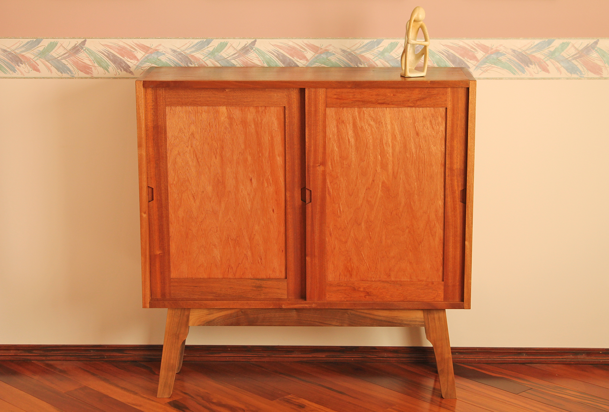 This credenza’s design was restricted by storage needs and space confinements.