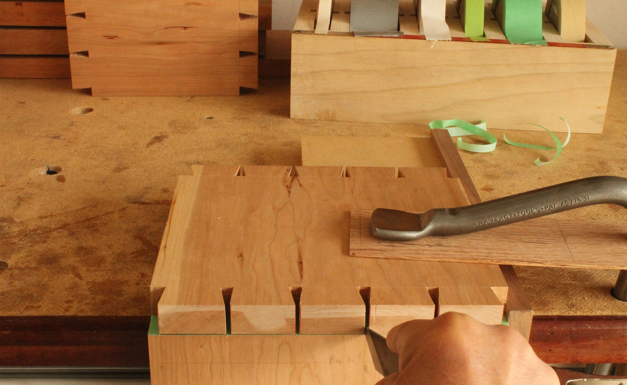 Using tape to help cut dovetails.