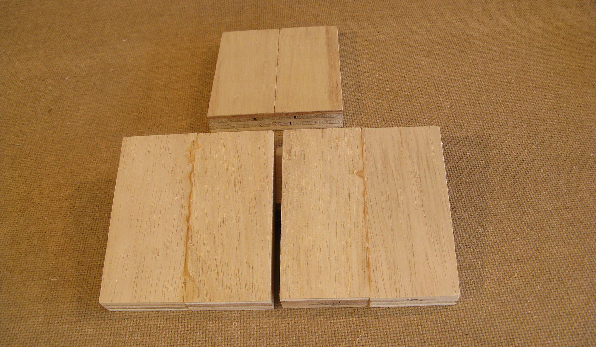 Three glued wooden blocks.