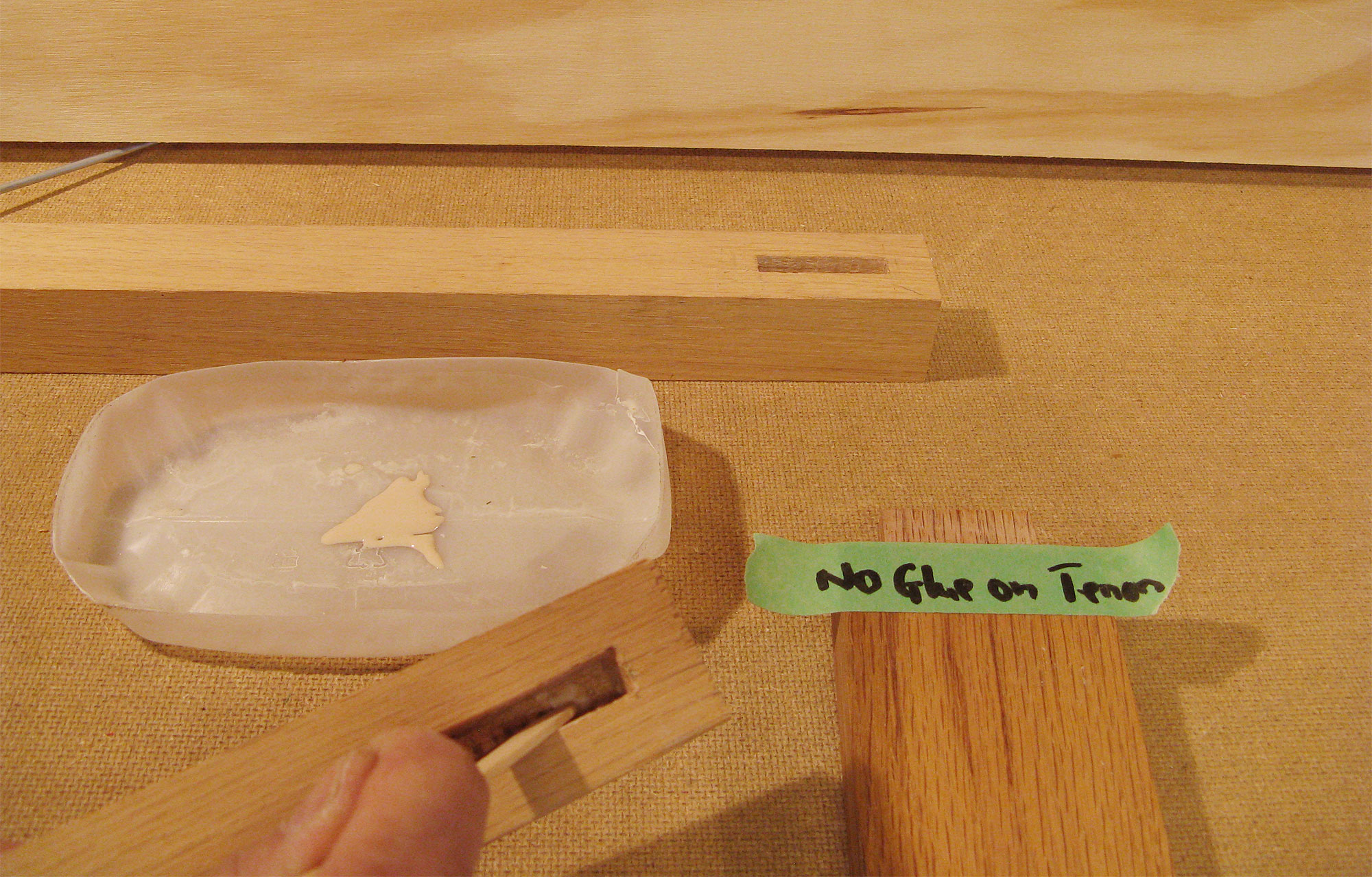 Applying glue to mortise.