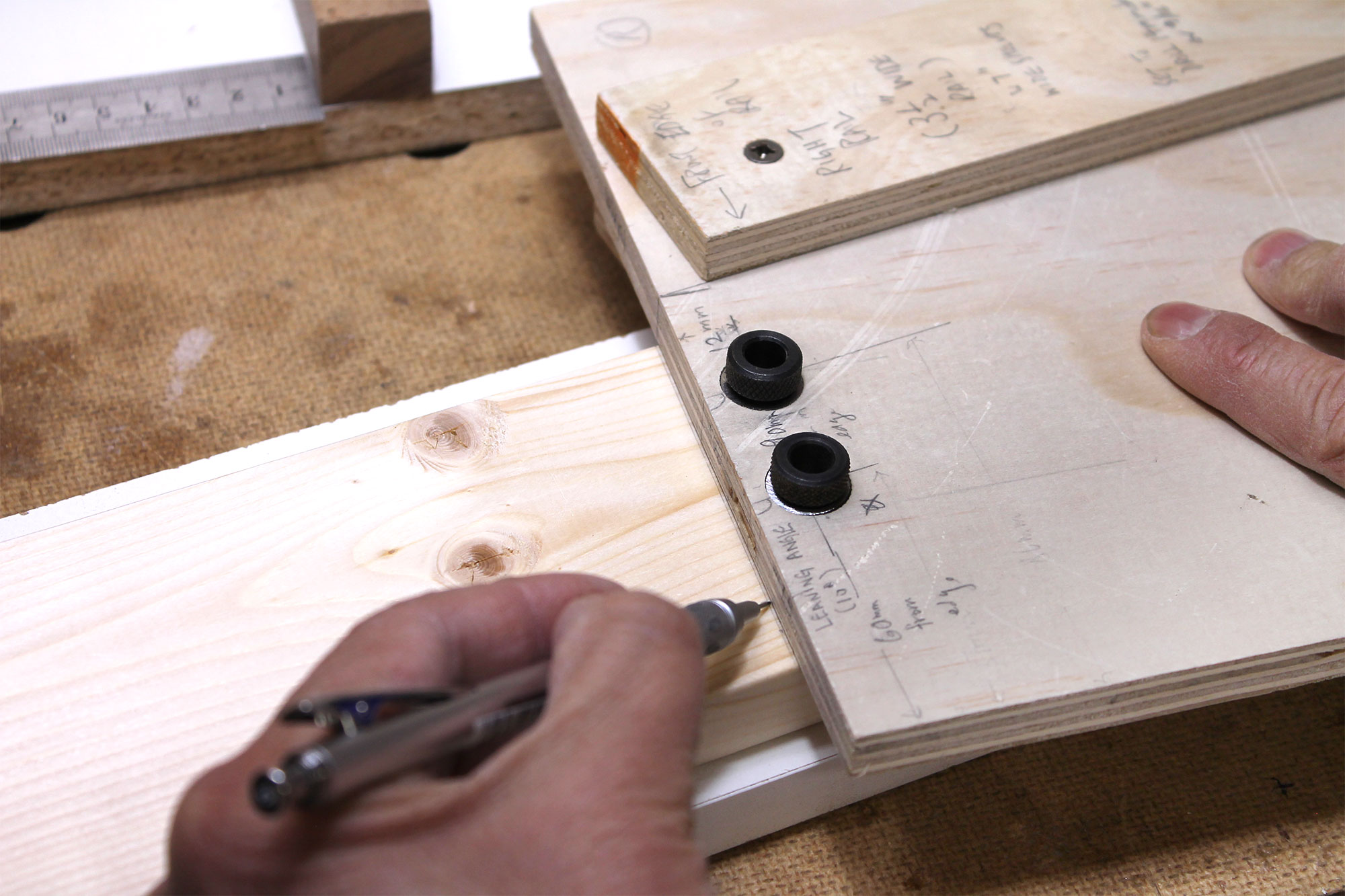 Using the top edge of the jig to lay out a new line.