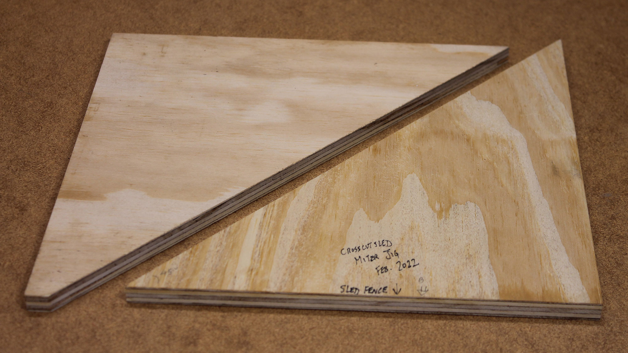 Photo 6 – These triangular fixtures enable the sled to cut miter corners.
