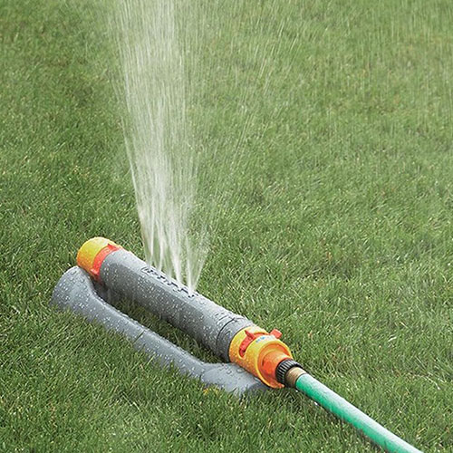Sprinkler watering a lawn.